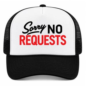 May include: A black and white trucker hat featuring a white front panel with the text Sorry NO REQUESTS printed in black script and bold red sans-serif lettering. The cap includes a black brim and black mesh side and back panels.