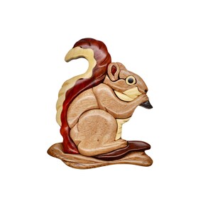 May include: A wooden squirrel figurine with a detailed, layered design. The squirrel is depicted in shades of brown, tan, and red, with a dark beak and a bushy tail. The figurine is sitting on a wooden base, showcasing the natural wood grain.