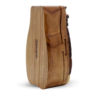 May include: A wooden puzzle box with a brown, natural wood finish. The box is shaped like a vase and has a unique, intricate design. The box is closed and the brand name "Woodensafe" is visible on the side.