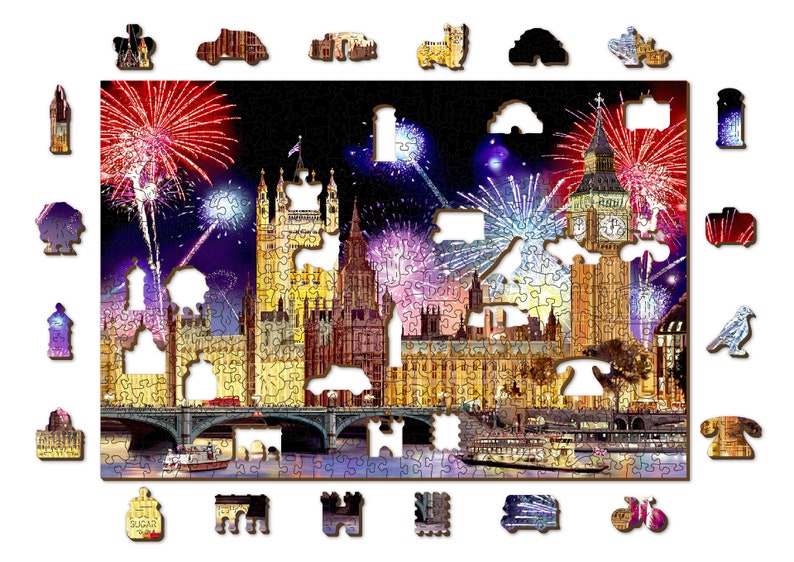 May include: A jigsaw puzzle depicting a nighttime view of the Houses of Parliament in London, England, with fireworks exploding in the sky above. The Big Ben clock tower is visible in the center of the image. The puzzle is made of wood and has a brown frame.