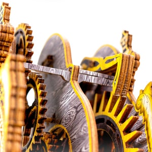 May include: Close-up of a wooden clockwork mechanism with intricate gears and a yellow and black color scheme. The clockwork is made of wood and has a detailed design.
