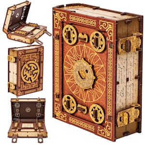 May include: A wooden puzzle box shaped like a book with a dark red cover, gold sun and star engravings, and a central circular dial. The box features mechanical latches, side panels with handwritten script, and an interior grid with small dials.