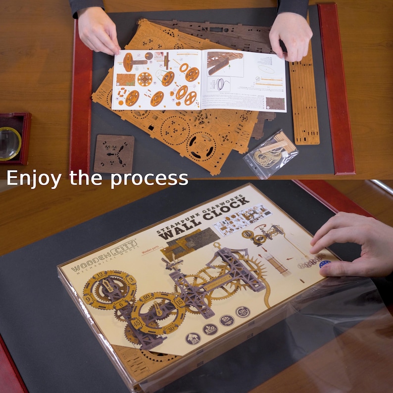 May include: A wooden steampunk gearworks wall clock kit with various laser-cut wooden pieces, gears, and instructions. The box is visible, along with the text "Enjoy the process."