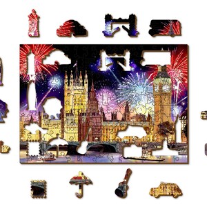 May include: A jigsaw puzzle depicting a nighttime view of London, England with fireworks exploding over the Houses of Parliament and Big Ben. The puzzle is made of wood and has a variety of colors, including red, white, blue, and gold.