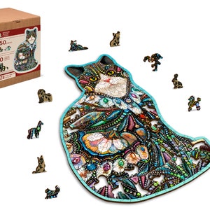 May include: A 250-piece wooden jigsaw puzzle featuring a colorful cat with intricate details. The puzzle pieces are scattered around the main image of the cat, along with a box showing the completed puzzle.