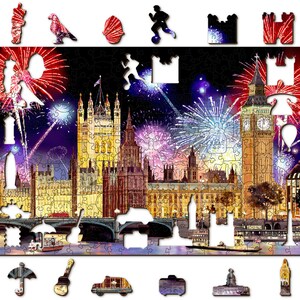 May include: A jigsaw puzzle featuring a nighttime view of the Houses of Parliament and Big Ben in London, England. The scene is lit up by fireworks exploding in the sky. The puzzle is made of wood and has a black background.