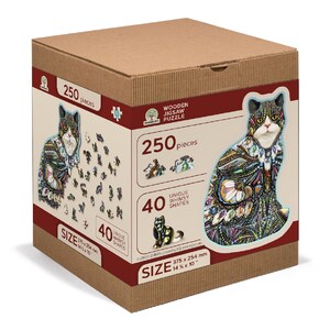 May include: A 250-piece wooden jigsaw puzzle featuring a colorful cat with a whimsical design. The puzzle box shows the completed puzzle image and includes the text "250 pieces" and "40 unique whimsy shapes". The puzzle measures 14.75 inches by 10 inches.