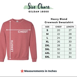 May include: Size chart for a Gildan 18000 heavy blend crewneck sweatshirt. The chart shows the chest and length measurements in inches for sizes S through 5XL.