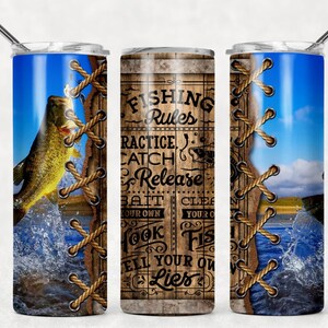 May include: A stainless steel tumbler with a blue and white design featuring a fish jumping out of the water. The tumbler has a rope-like design on the side and text that reads "Fishing Rules Practice Catch Release Bait Your Own Hook Fish Tell Your Own Lies".