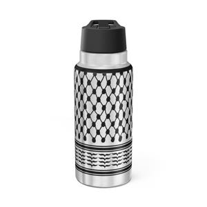 May include: Stainless steel water bottle with a black and white geometric pattern. The bottle has a black lid and a silver body. The design features a repeating diamond and dot pattern, with a border of stylized leaves.