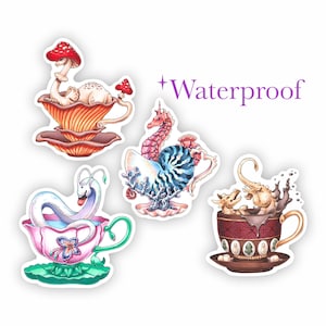 May include: Four colourful teacups with whimsical creatures inside. A mushroom, a seahorse, a snake, and two dragons are depicted in the teacups. The teacups are on a white background with the word "Waterproof" in purple text.