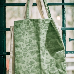 Toile pattern and wedding crest on tote bag