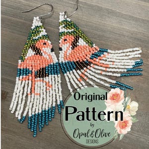 May include: A pair of beaded earrings featuring a pink flamingo design. The earrings are crafted with white, pink, teal and green beads. The earrings are long and dangle. The earrings are labelled "Original Pattern by Opal & Olive Designs."