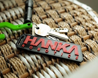 Bagtag, Plastic, Palm Size, script Hanka Robotics, for fans of Ghost in the Shell.