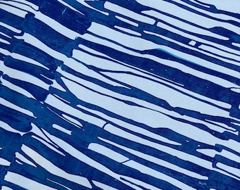 May include: Abstract pattern featuring diagonal brushstrokes in shades of blue against a white background. The design has a hand-painted appearance, with varying stroke widths and overlapping areas, creating a textured effect.