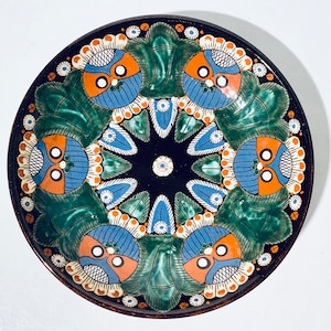 May include: A set of three ceramic mugs with a speckled, matte finish. The mugs are in shades of cream, light gray, and dark gray. Each mug has a simple, minimalist design, perfect for coffee or tea.