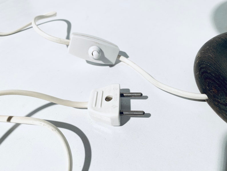 May include: White electrical cord with a white inline switch and a white two-prong plug.