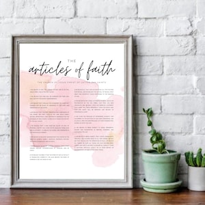 May include: A printable poster with a watercolor background in shades of pink and yellow. The poster features the text "The Articles of Faith" in black script font. The text is followed by a list of the 13 Articles of Faith of The Church of Jesus Christ of Latter-day Saints.
