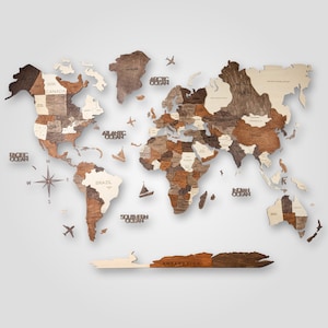 May include: A wooden world map puzzle with different coloured wood pieces representing different countries. The map includes the names of continents, oceans, and countries.