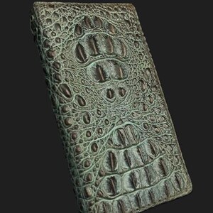 May include: A green alligator skin wallet with a textured pattern.