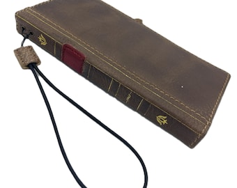 May include: A brown leather phone case with a gold and red spine design. The case has a strap attached to it.