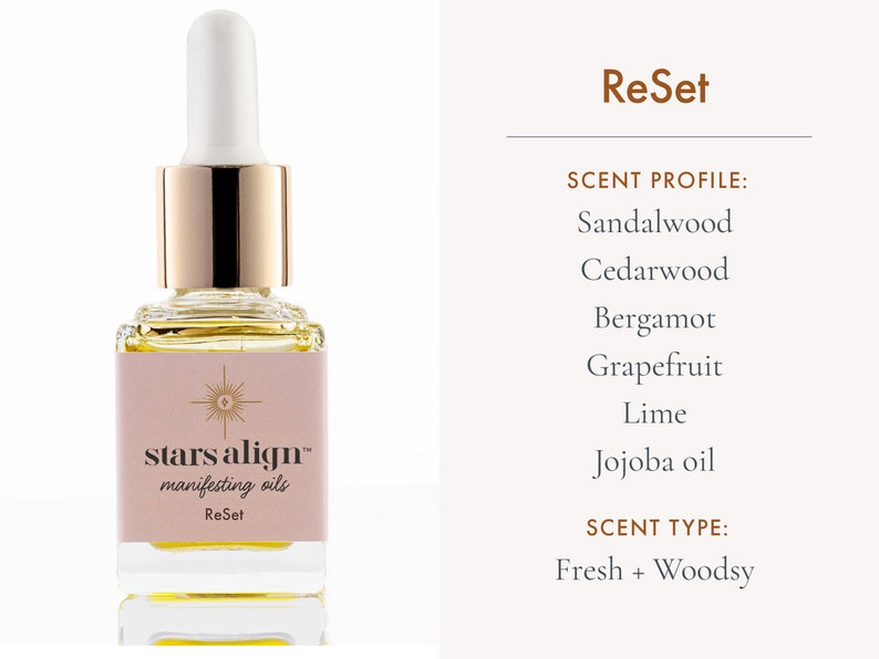 May include: A glass bottle of stars align manifesting oil labeled "ReSet" with a gold cap and dropper. The scent profile is sandalwood, cedarwood, bergamot, grapefruit, lime, and jojoba oil. The scent type is fresh and woodsy.