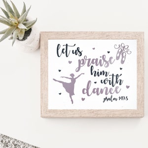 May include: A framed print with a white background and a silhouette of a ballerina dancing. The text reads "Let us praise him with dance" and "Psalm 149:3".