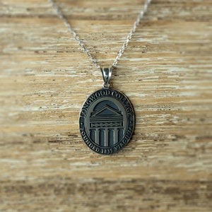 May include: Silver chain necklace with a round pendant featuring the Longwood College logo. The pendant is engraved with "Longwood College" and "Founded 1839 Virginia".