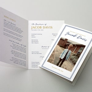 May include: A white and blue programme for a christening ceremony. The programme includes the name "Jacob Davis" in gold lettering and a photo of a young boy in a suit. The programme also includes the date "November 25th, 2021".