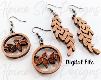 May include: A set of three wooden earrings featuring a leafy design. The earrings are made of natural wood and have a rustic, organic look. The earrings are perfect for adding a touch of nature to any outfit.