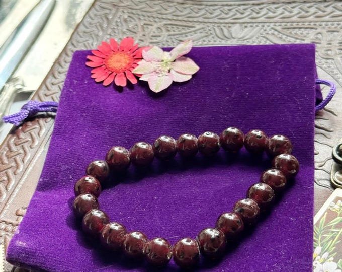 Deep red art glass bead bracelet with painterly black flecks
