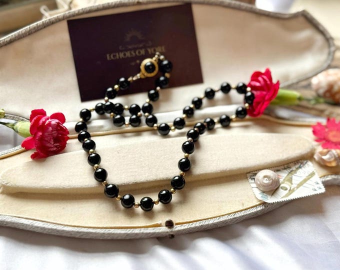 Vintage short black glass bead necklace with gold-tone clasp