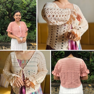May include: A collection of crochet tops in various colors. One is a light pink with ruffled sleeves and a button closure. Another is a cream-colored cardigan with a tie closure and bell sleeves. The tops are handmade and have an open weave design.