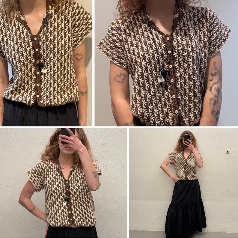 May include: A short-sleeved, button-down crochet top in brown and cream. The top features a V-neck and a repeating pattern. The buttons and trim are brown. The top is paired with a black skirt. The style is vintage.