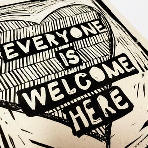 Everyone is welcome here. Community, you are worthy Lino style illusration, block style print, activism, feminism, social justice, heart art