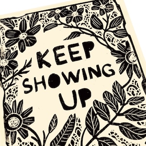 May include: Black and white print with a floral border and the text "KEEP SHOWING UP" in the center.