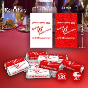 May include: Red and white 40th anniversary favor boxes with a red glitter background. The boxes are 1.5 inches wide and 2.5 inches tall. The text on the boxes reads "Happy 40th Anniversary".