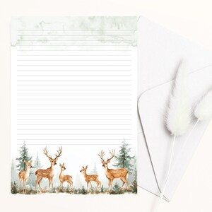 May include: A white lined paper with a green watercolor background and a border of brown deer and pine trees. The deer are in various poses, including standing, walking, and looking up.
