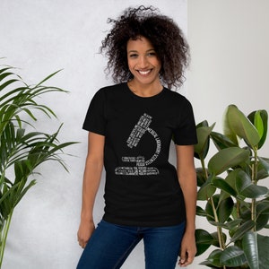 May include: Black t-shirt with a white graphic of a microscope made of words related to medical laboratory science. The words include "pipettes", "tests", "reliable", "collaborate", "medical laboratory", and "scientists".