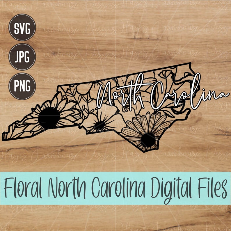 May include: Black and white floral design of the state of North Carolina with the text "North Carolina" in white cursive lettering.