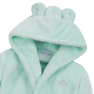 May include: A light green hooded robe with bear ears on the hood. The robe has a tie closure and an embroidered elephant on the front. The label reads "Babytown" and "0-6 mo".