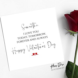 May include: A white card with black text that reads "Samantha I LOVE YOU TODAY, TOMORROW, FOREVER AND ALWAYS Happy Valentine's Day" with two red hearts. The card is on a white background with a red rose.