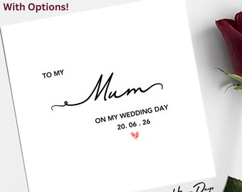 Peut inclure: Une carte blanche avec du texte noir qui dit "To My Mum On My Wedding Day 20.06.26" avec un petit cœur rose. La carte a un logo noir et blanc qui dit "Happy Days Stationery".