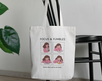 Focus & Fumbles • Eco-Friendly Canvas Tote Bag • Canvas Chronicles Collection