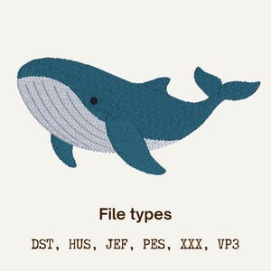 Puede incluir: Un diseño de ballena bordada azul con vientre blanco y ojo negro. La imagen incluye el texto "File types" y enumera formatos de archivo: DST, HUS, JEF, PES, XXX, VP3. Este diseño es adecuado para proyectos de bordado.