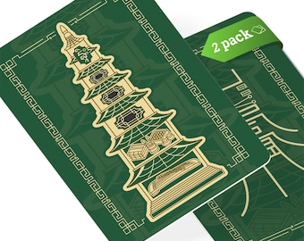 May include: Two green and gold pagoda-style cards with a decorative border. The text "2 pack" is printed on the top right corner of one card.
