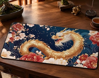 May include: A rectangular desk mat featuring a large, golden dragon winding across a deep blue background. The design includes intricate white and red floral patterns, swirling wave motifs, and small white dots scattered across the dark surface.