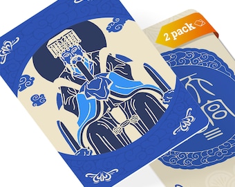May include: Two blue and white playing cards with a Chinese character on one card and a drawing of a person in a blue and white robe on the other card. The cards have a 2 pack label on the top right corner.