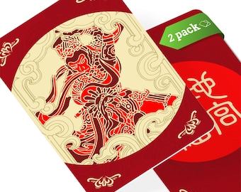 May include: Two red playing cards with gold and red illustrations. One card features a red and gold illustration of a mythical figure. The other card features the Chinese character for "good fortune". The cards have a 2 pack label.