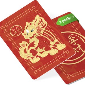 May include: Two red Chinese New Year cards with gold trim. One card features a gold lion with the text "Water and Fire" in Chinese. The other card features a gold circle with the text "Prosperity" in Chinese. The cards are labeled "2 pack".